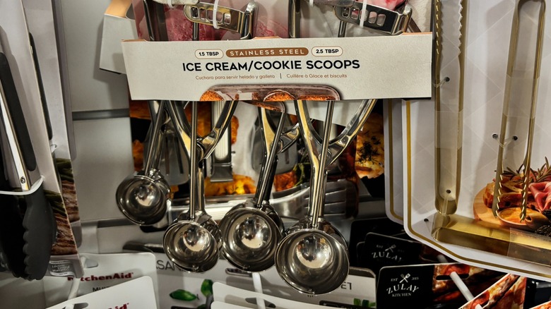 A cookie scoop from HomeGoods hangs on a rack.
