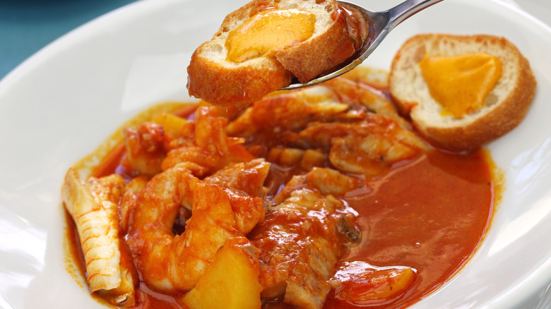Close up of Bouillabaisse with croutons topped with rouille