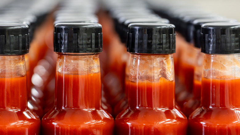 Bottles of hot sauce in a factory