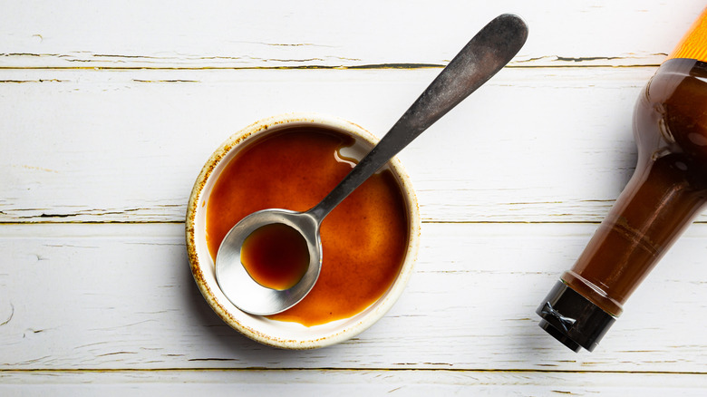 Bowl and bottle of Worcestershire sauce