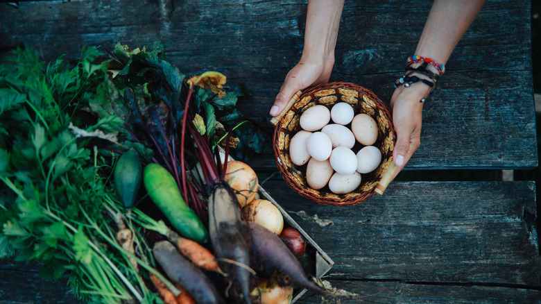 bowl of eggs near fresh vegetables
