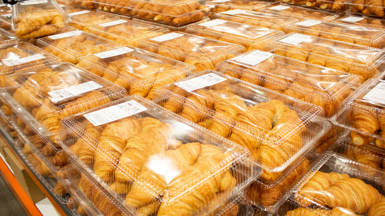 stacks of croissant packages on display at costco warehouse