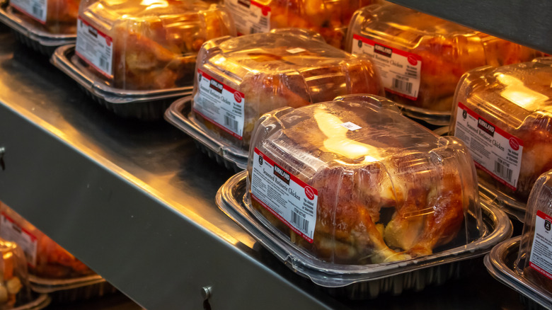 several kirkland signature rotisserie chickens packaged on shelf at Costco