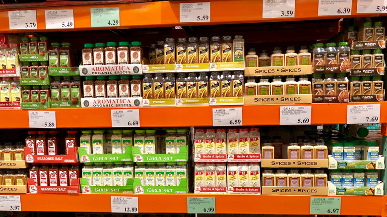 shelves at costco full of various containers of spices