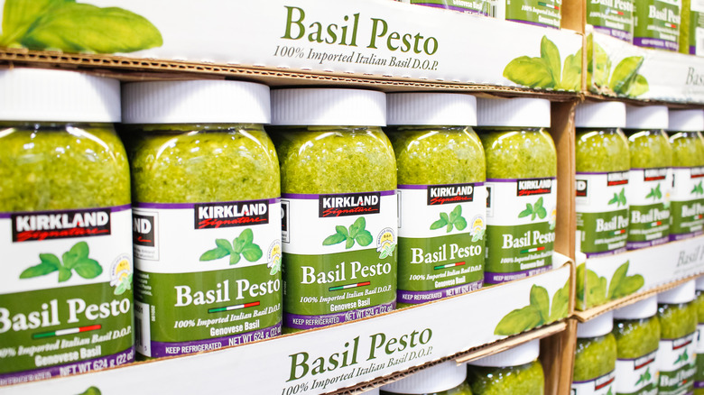 Jars of Kirkland Basil Pesto stacked on shelves