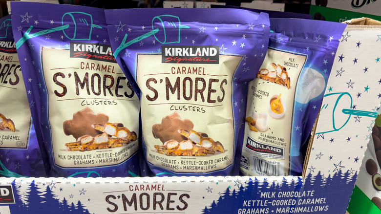 Bags of Kirkland caramel s'mores clusters in a box on a shelf
