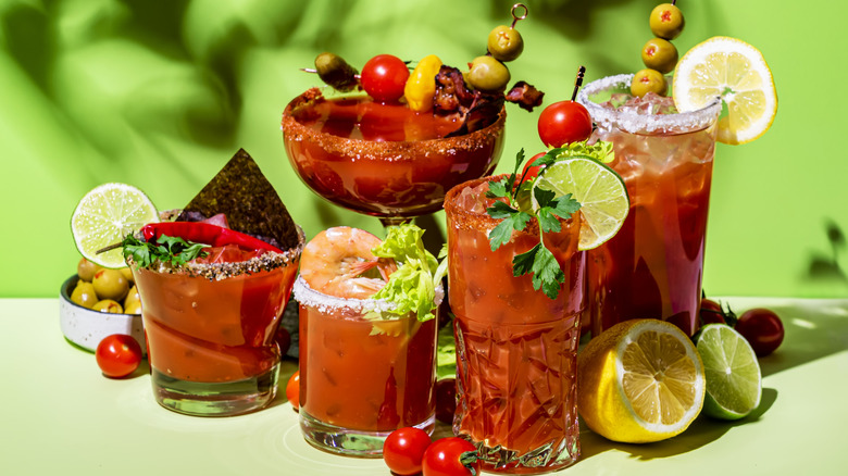 Collection of Bloody Mary cocktails with an abundance of garnishes
