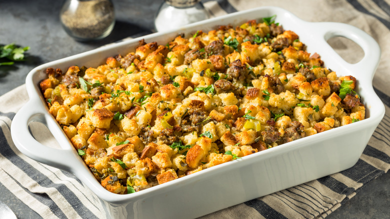 White casserole dish of holiday stuffing
