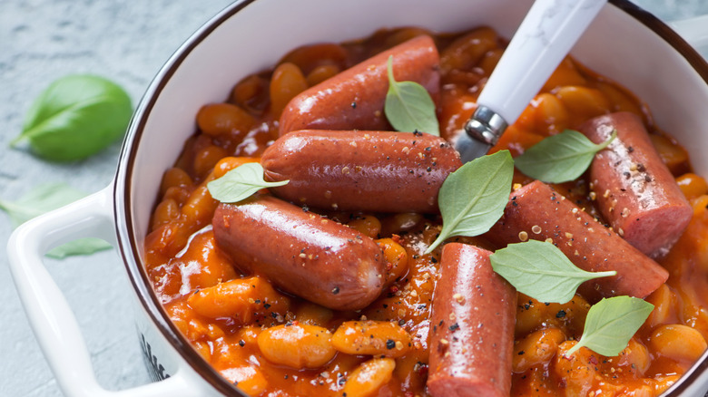 White bowl full of bean and hot dog chili