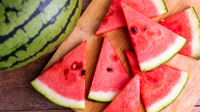 Watermelon slices on a wooden cutting board