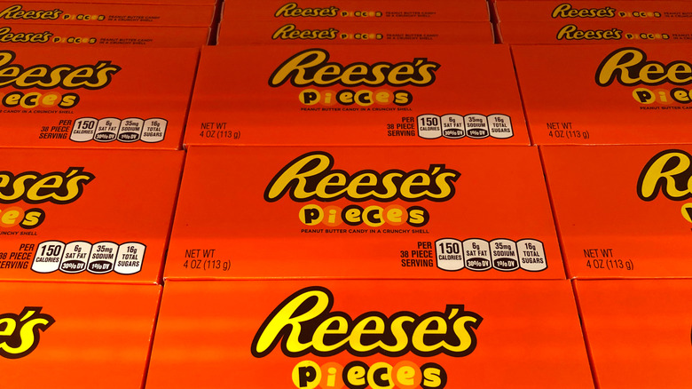 Boxes of Reese's Pieces arranged in a store display