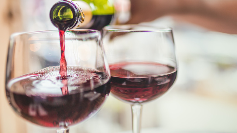 red wine being poured into glass