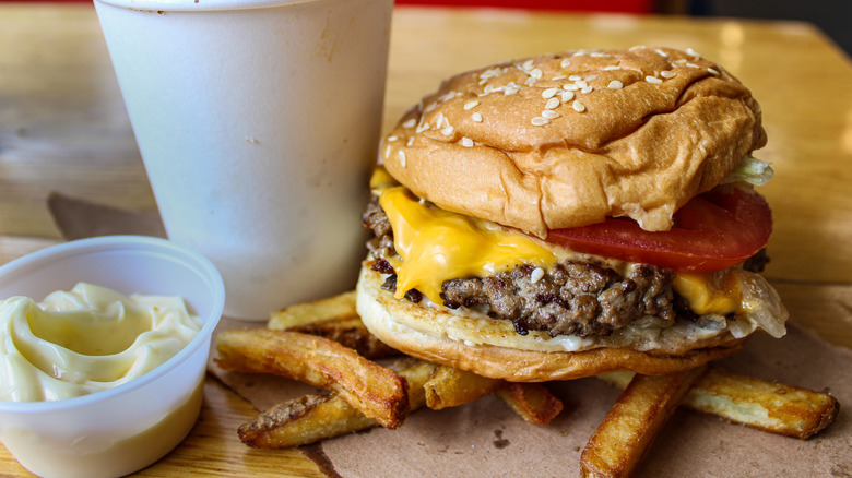 Five Guys cheese hamburger with french fries and side of mayo