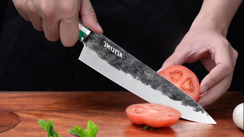 HC Steel Home Essentials Gyuto Knife slicing into a tomato.