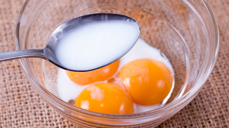 cream in spoon with eggs