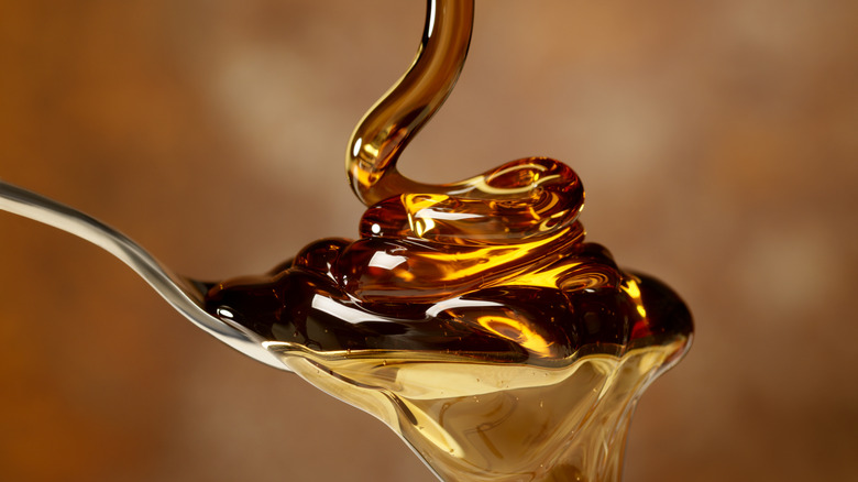 maple syrup poured onto spoon