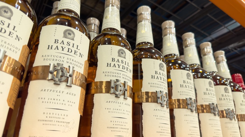 rows of Basil Hayden bottles on the shelf