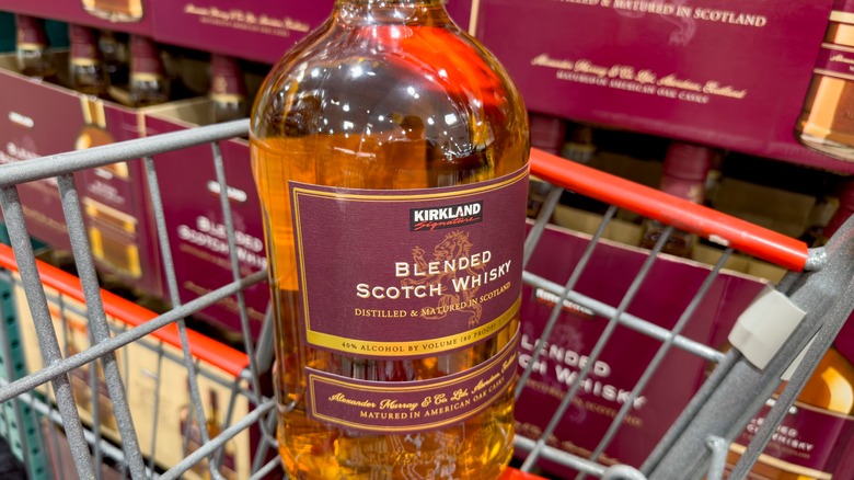 a bottle of Kirkland Signature Blended Scotch Whisky in a cart