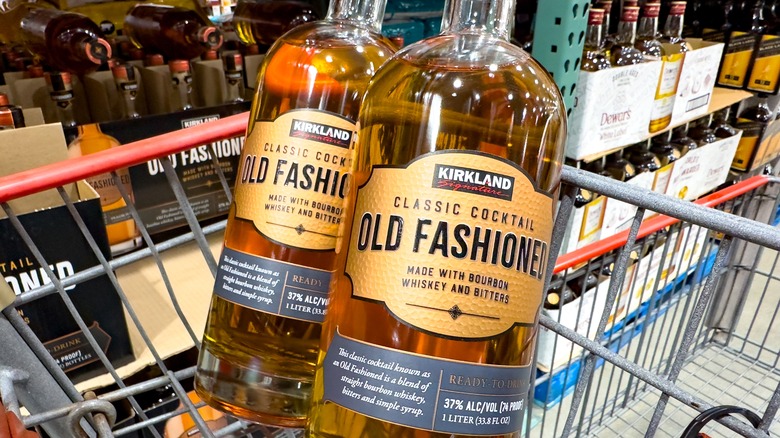 two bottles of Kirkland Signature Old Fashioned Whiskey in a cart