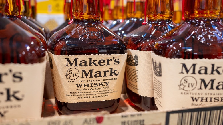 bottles of Maker's Mark lined up in a store