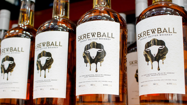 bottles of Skrewball lined up on a shelf
