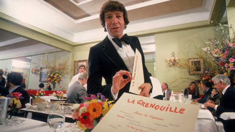 waiter explaining menu at New York restaurant
