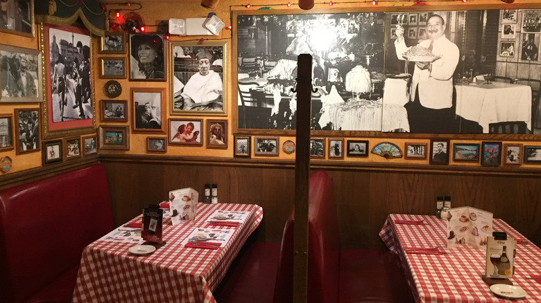 Eclectic art representing Italian culture over booths at a Buca di Beppo
