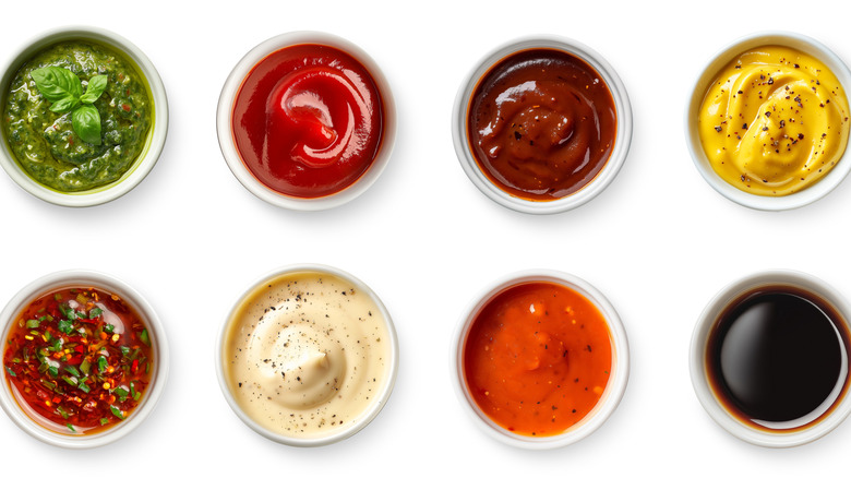 sauces lined up against a white backdrop