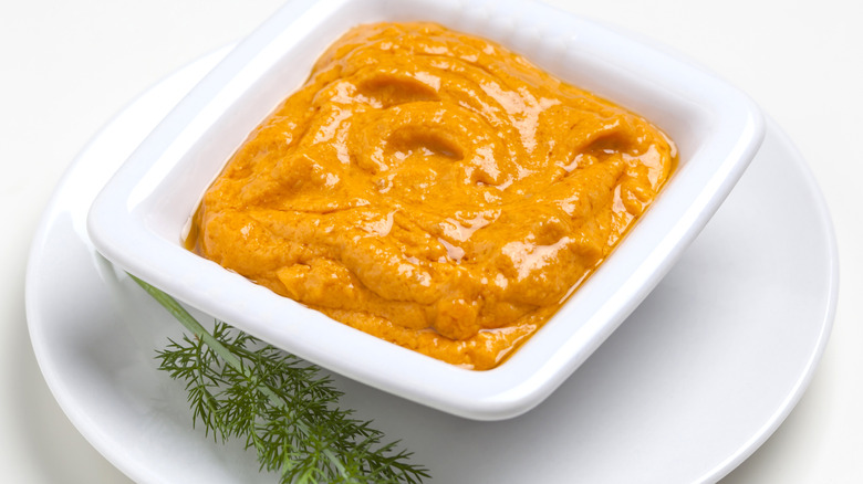 romesco sauce in a white container