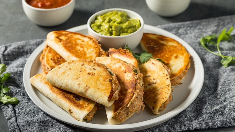 mini chicken quesadillas with salsa and guacamole