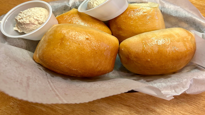 Basket of rolls served with honey cinnamon butter