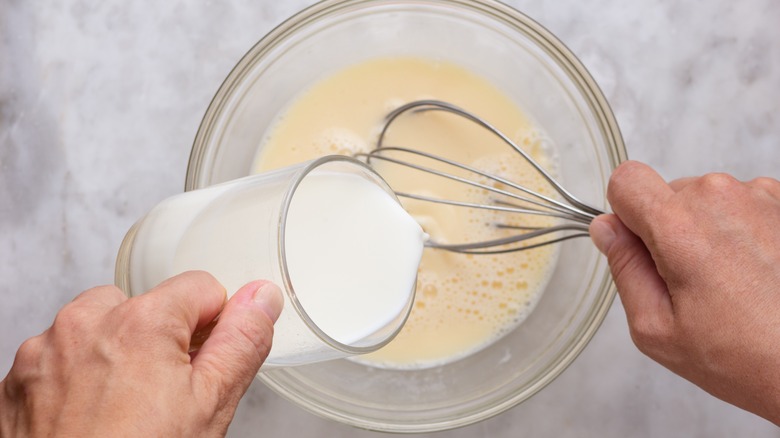 Adding milk to bowl