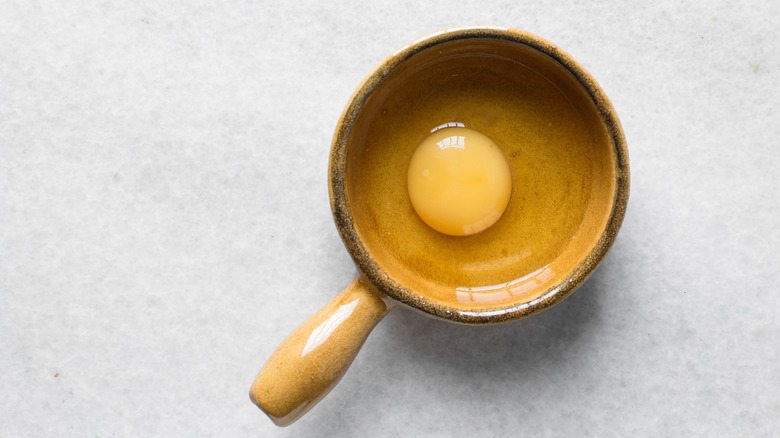 raw egg in ramekin