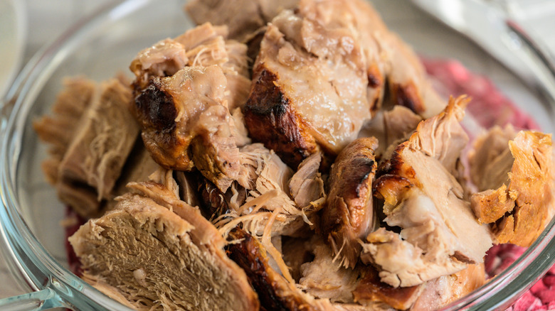 close up of a bowl of leftover slices of pork
