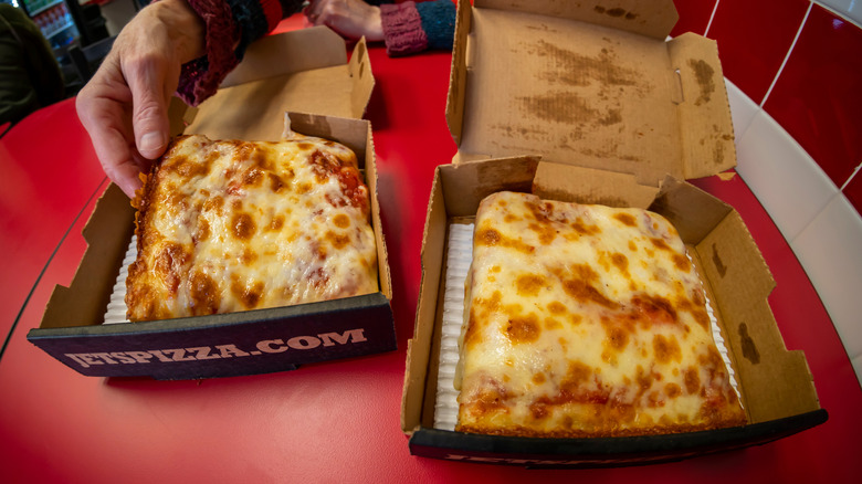 Two slices of Jet's Pizza in individual boxes.