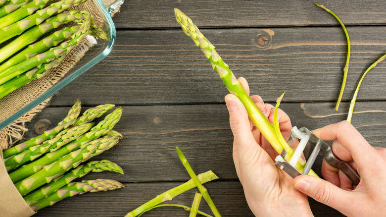 peeling asparagus