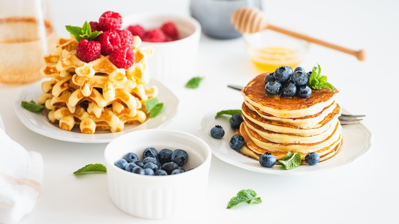 Pancakes and waffles served with fruit