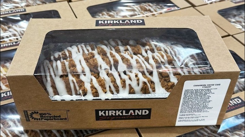 A stack of boxed Cinnamon Coffee Cakes sits in a Costco bakery