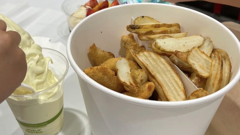 Costco Japan Chicken Stick bucket served with a cup of Hokkaido soft cream