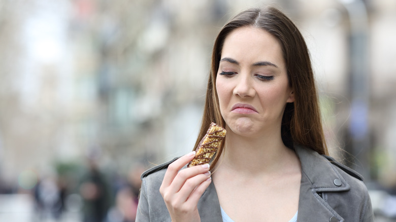 woman disgusted with snack bar