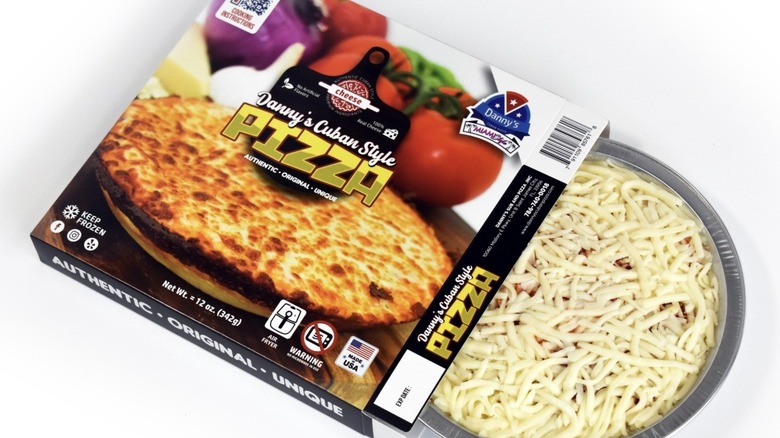 Frozen Danny's Cuban Style pizza sliding out of its package