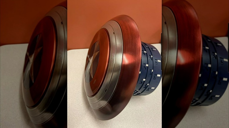 A replica of Captain America's shield with a collapsible popcorn bucket attachment