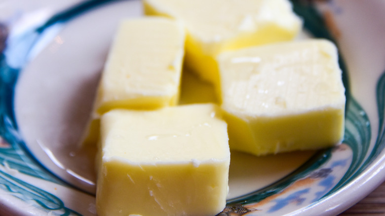 Cubes of butter on side plate