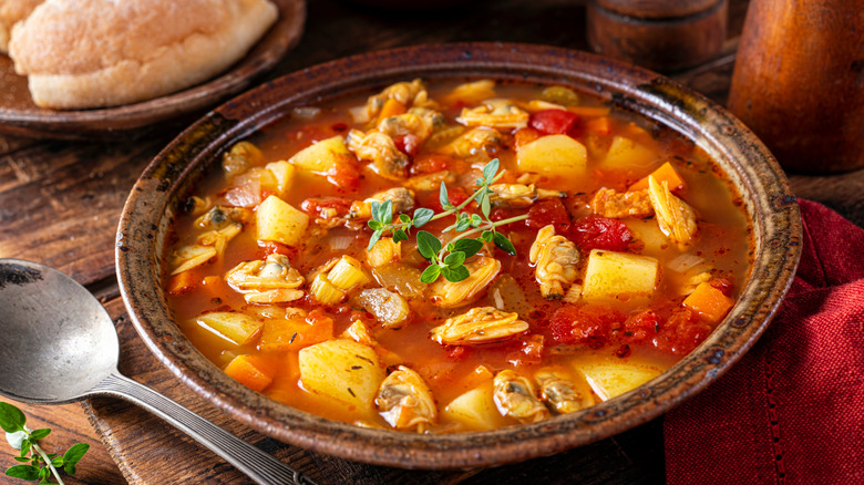 Bowl of Manhattan clam chowder with potatoes