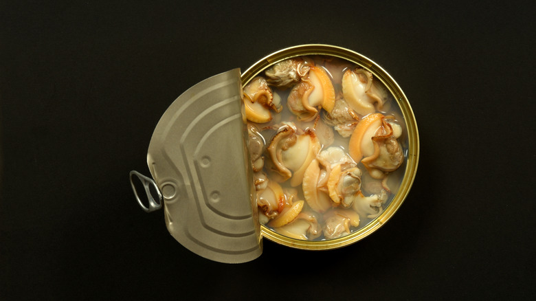 Opened tin of clams in clam juice