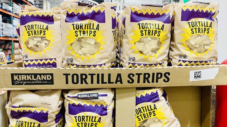Bags of Kirkland Signature Tortilla Strips on display in Costco
