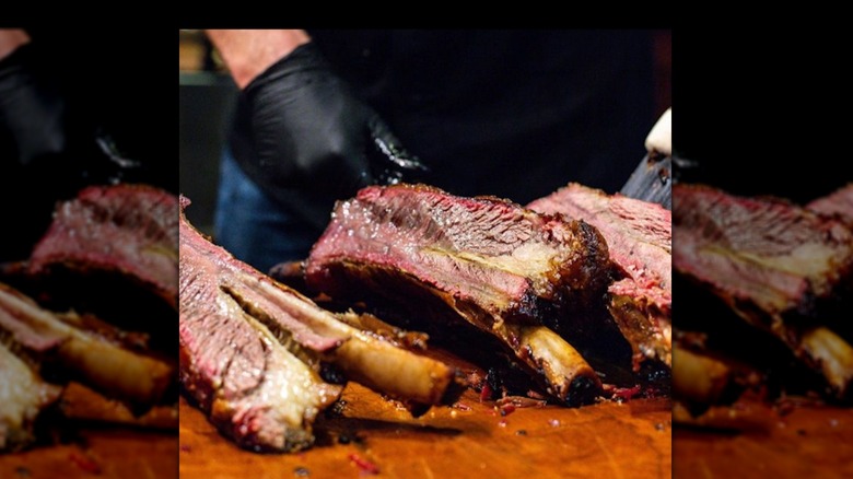 chef cutting ribs