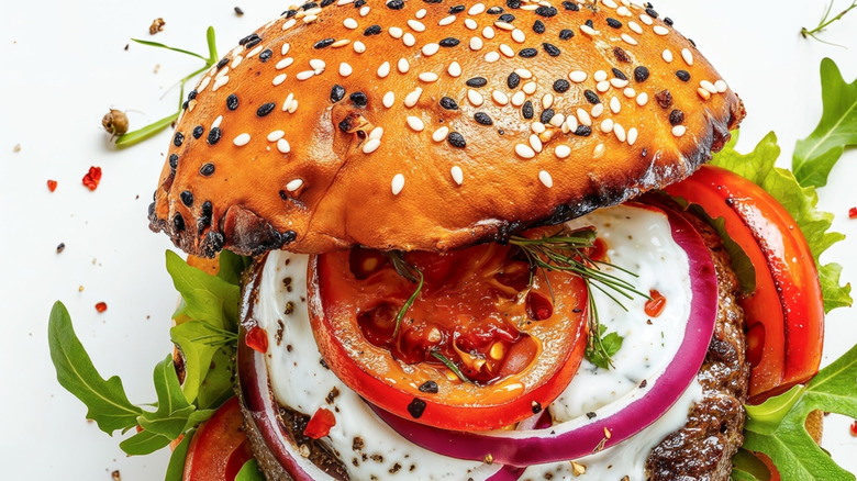 Open-faced bruger with many toppings