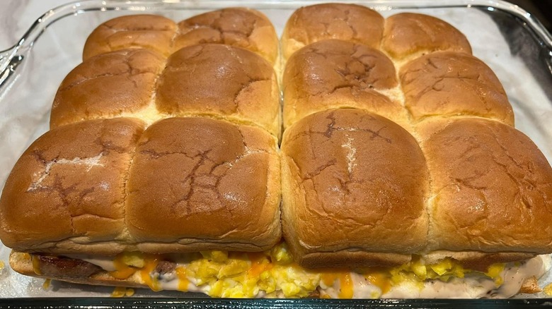 Breakfast sliders sit in a casserole dish
