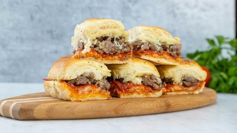 Pizza sliders sit in a stack.